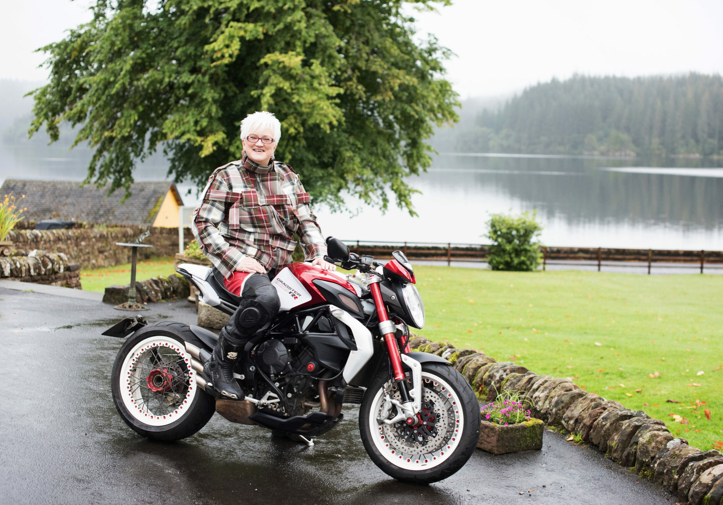 This shows Susan with her MV Agusta motorcycle. She is a keen motorcyclist.